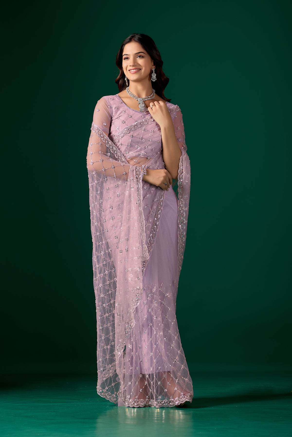 Lavender party wear saree with cutdana work by Kanyaari, featuring intricate embroidery and elegant draping.
