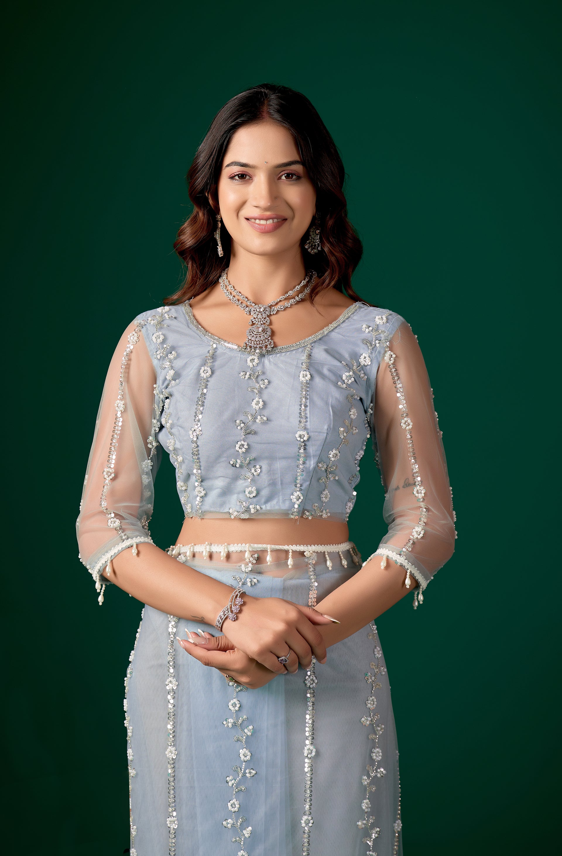 Kanyaari Tamannaah sky blue net saree with intricate cutdana work, featuring elegant draping and detailed embroidery.