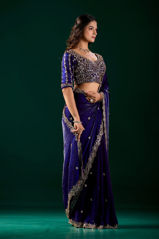 Blue heavy saree with intricate cutdana work by Kanyaari, featuring elegant blue fabric and detailed embroidery.