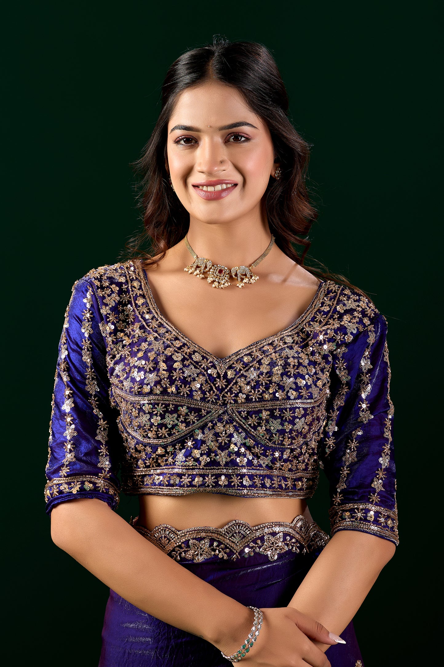 Blue heavy saree with cutdana work from Kanyaari, featuring intricate embellishments and flowing fabric.