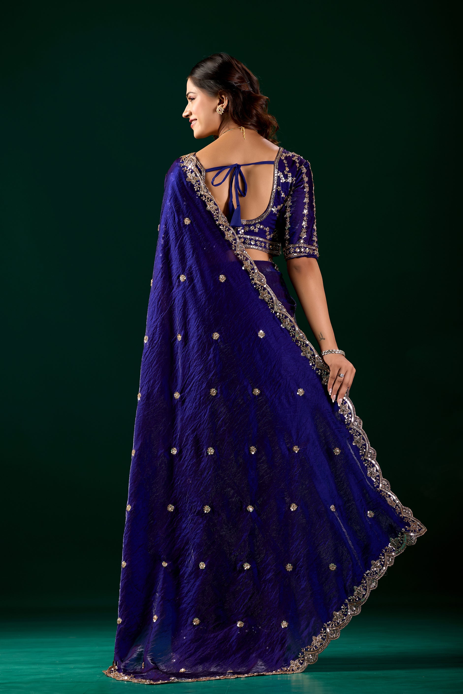Blue full heavy saree with intricate cutdana work from Kanyaari, featuring elegant blue fabric and detailed embroidery.