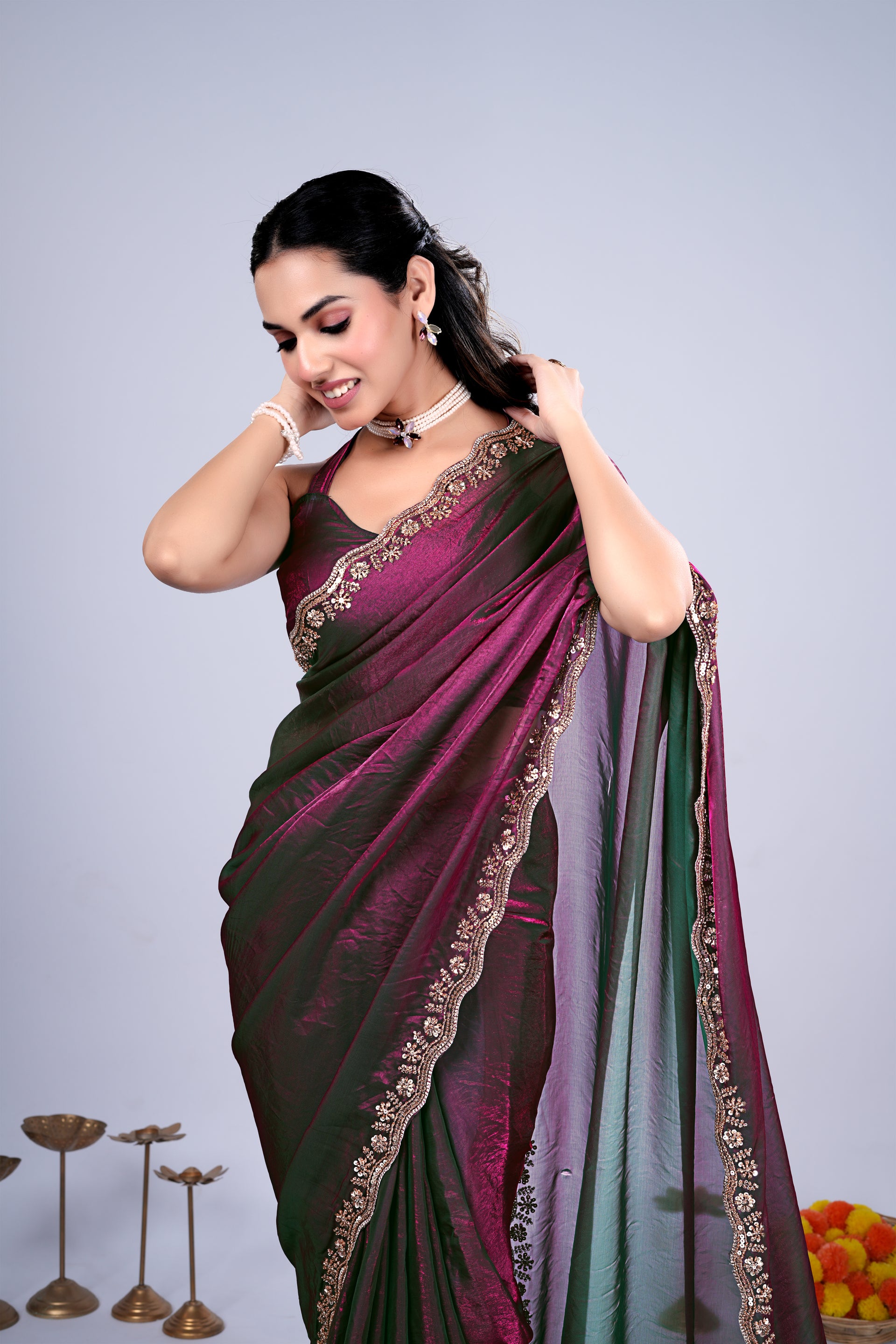 Kriti stylish wine-colored saree with intricate cutdana work by Kanyaari, displayed on a mannequin.