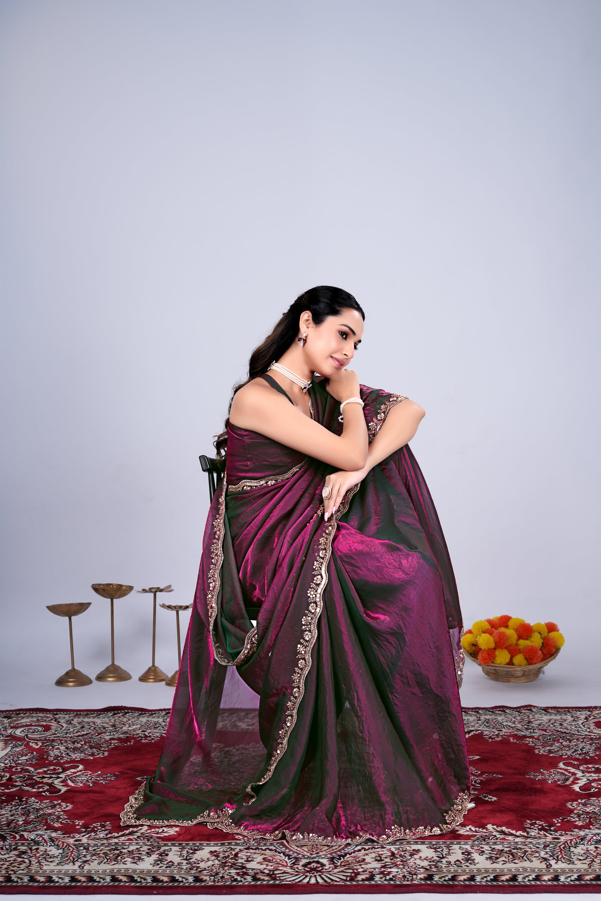 Wine-colored Kriti saree by Kanyaari with elegant cutdana work, draped showcasing intricate embroidery and rich fabric details.