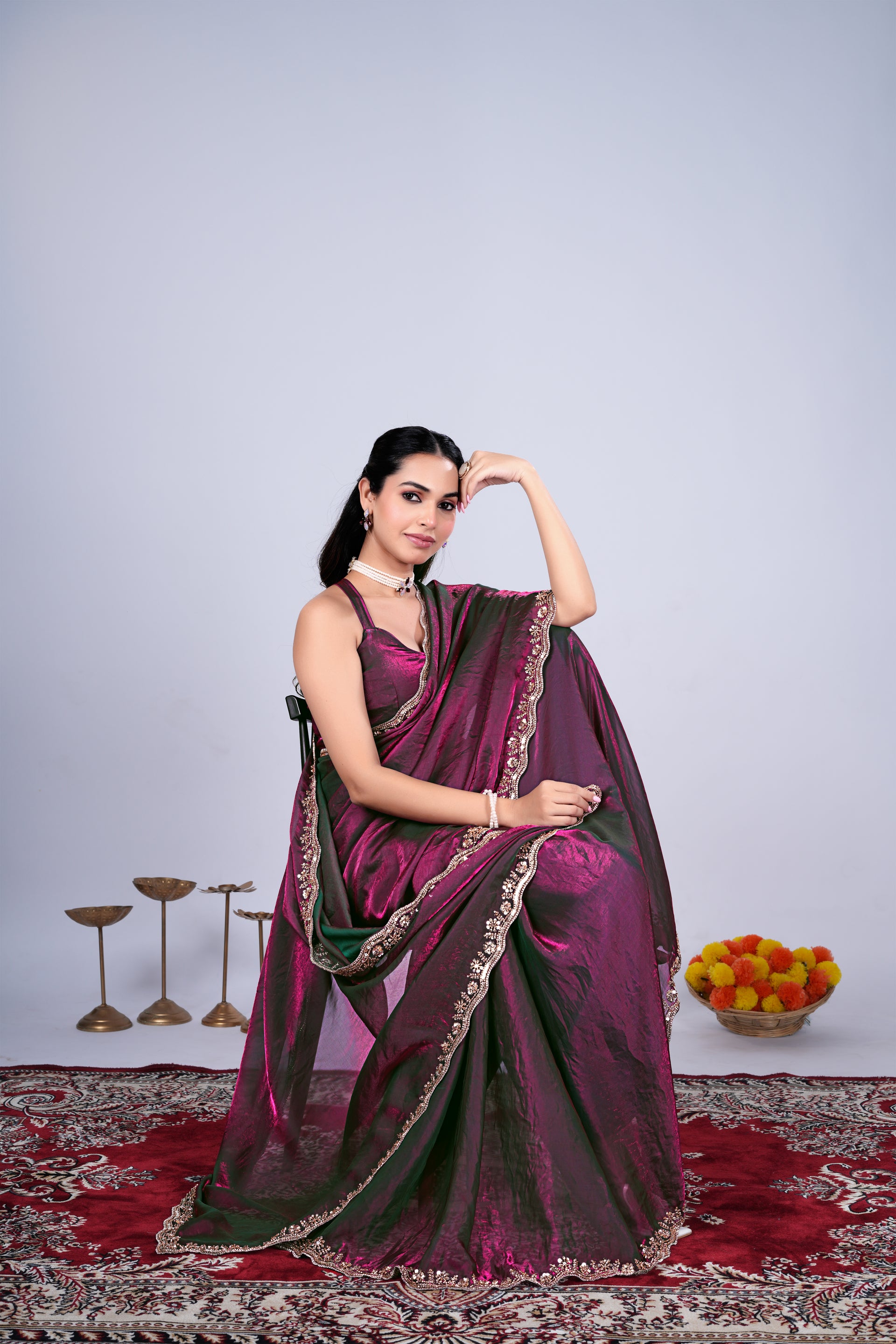 Kriti stylish wine-colored saree by Kanyaari with intricate cutdana work, draped elegantly showcasing detailed embroidery and fabric texture.