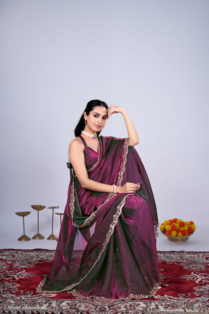 Kriti stylish wine-colored saree by Kanyaari with intricate cutdana work, draped elegantly showcasing detailed embroidery and fabric texture.