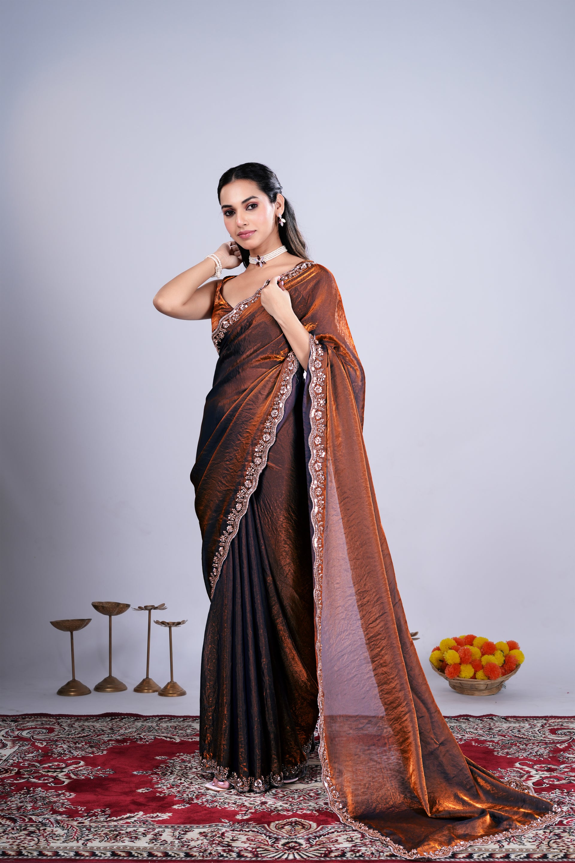 Kanyaari Kriti stylish brown saree with intricate cutdana work, showcasing elegant traditional design and detailed craftsmanship.