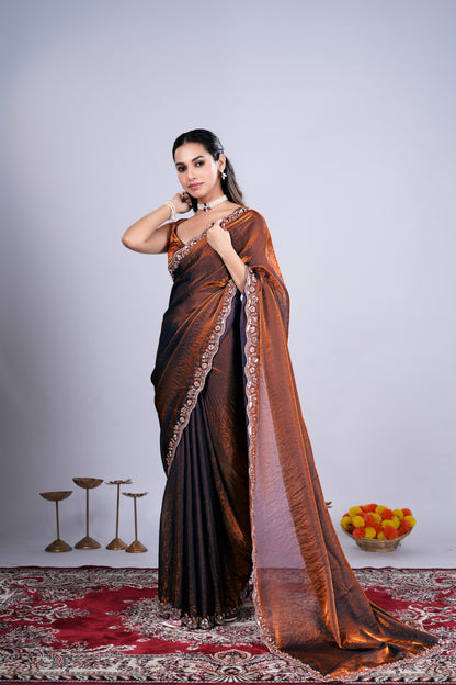 Kanyaari Kriti stylish brown saree with intricate cutdana work, showcasing elegant traditional design and detailed craftsmanship.