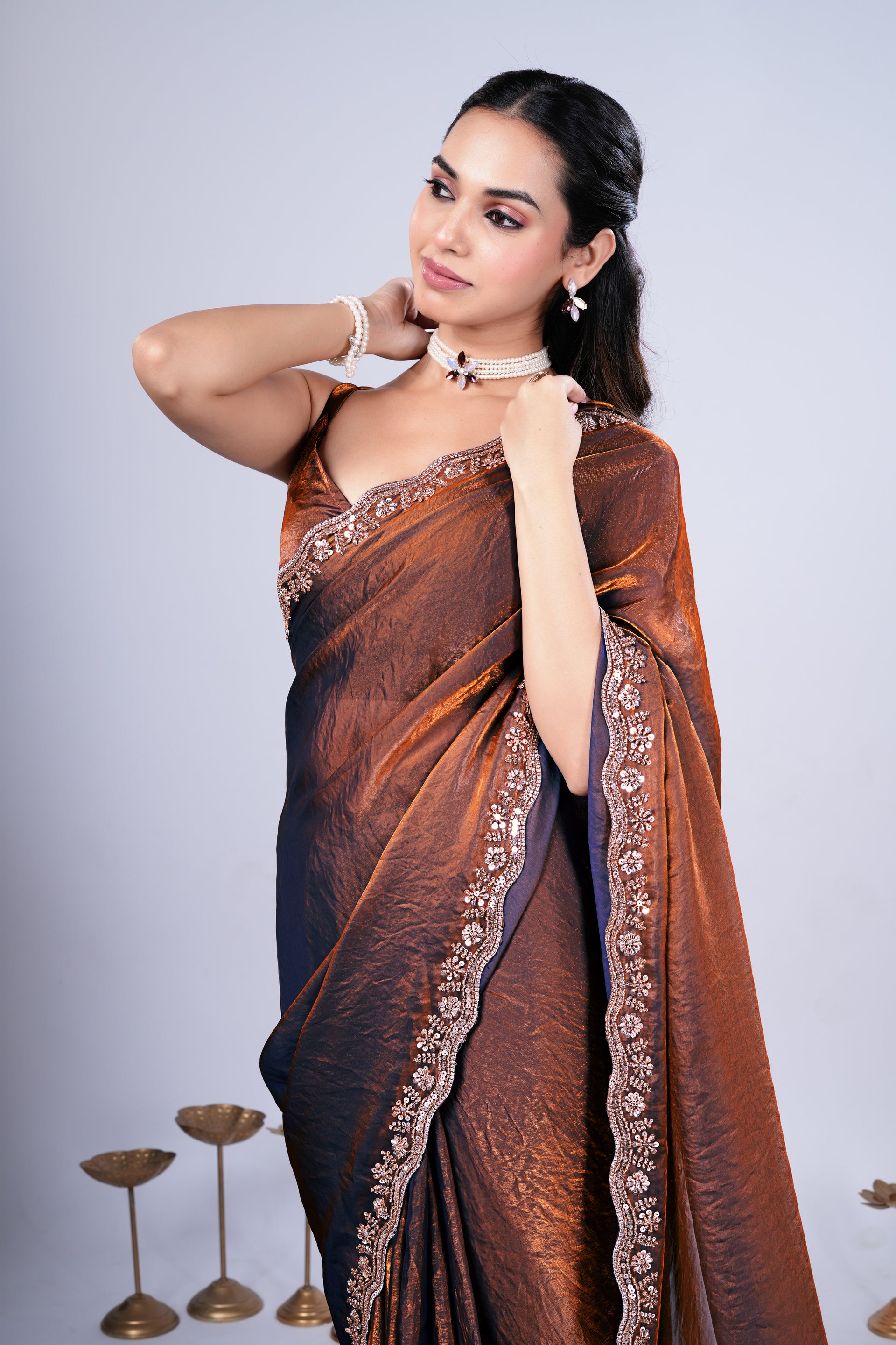 Kriti stylish brown saree with intricate cutdana work by Kanyaari, displayed draped on a mannequin.
