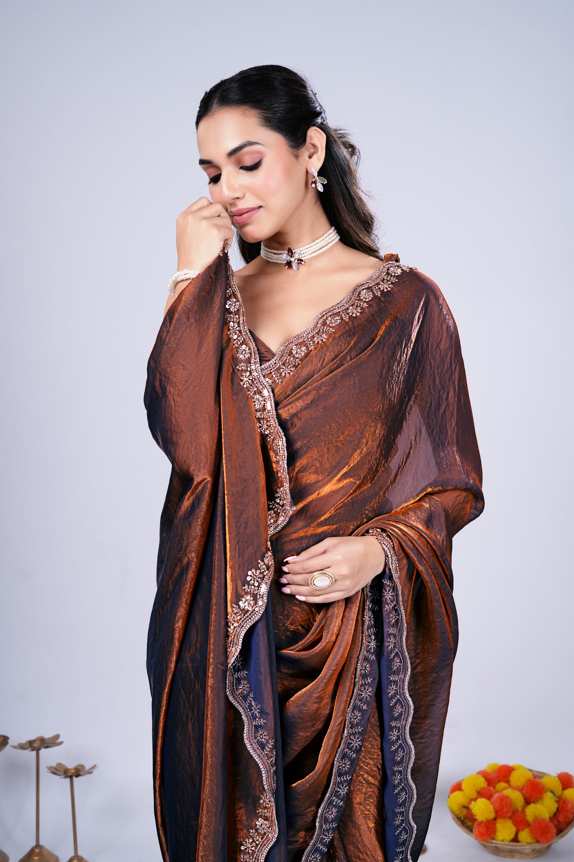 Brown Kriti stylish saree by Kanyaari featuring intricate cutdana work, draped elegantly showcasing traditional craftsmanship.