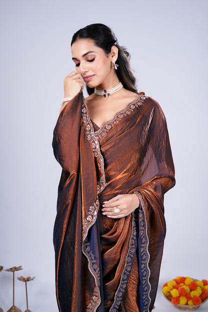 Brown Kriti stylish saree by Kanyaari featuring intricate cutdana work, draped elegantly showcasing traditional craftsmanship.