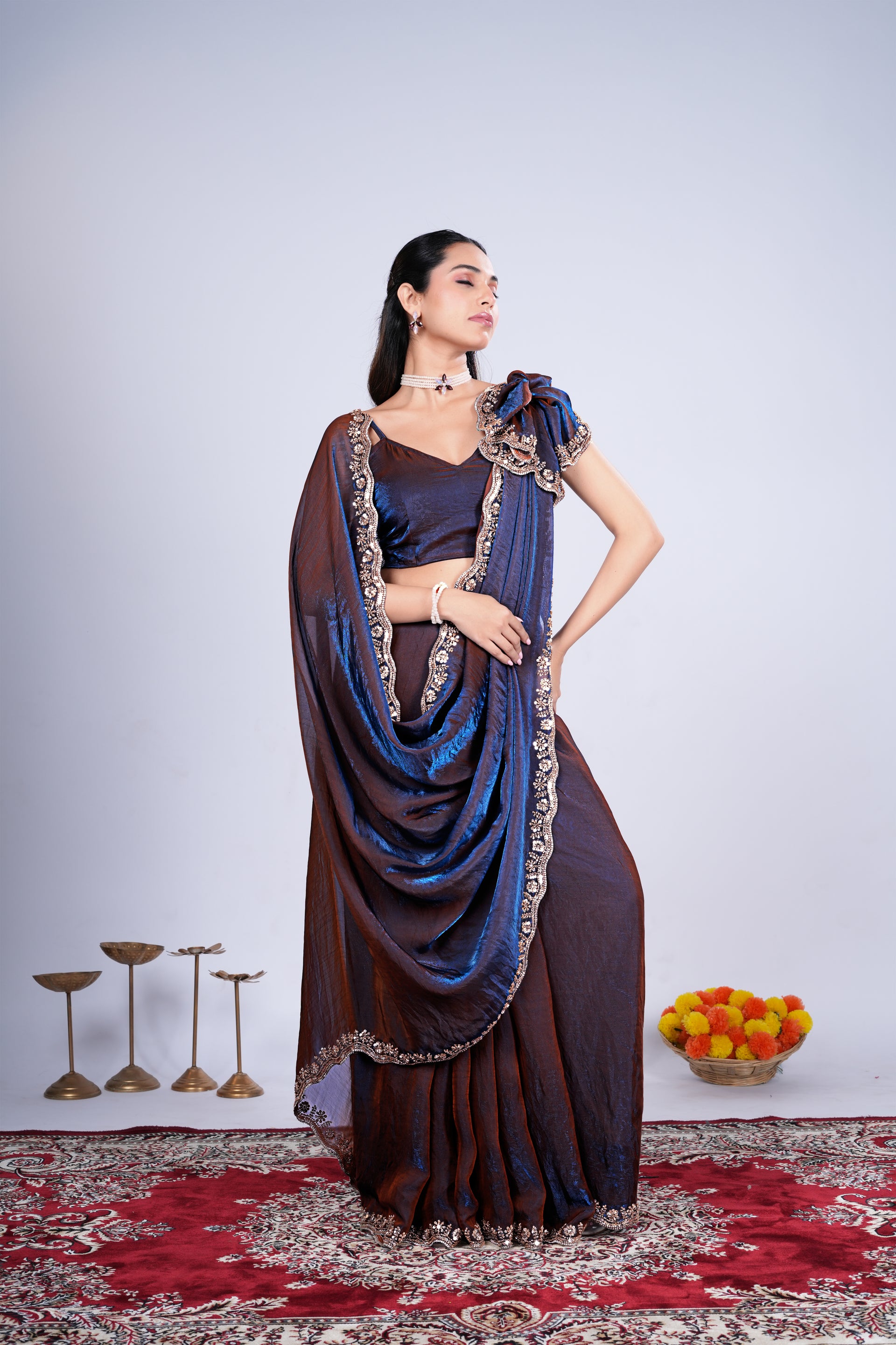 Blue Kriti saree by Kanyaari with intricate Cutdana work, draped elegantly to showcase detailed embroidery and rich fabric.