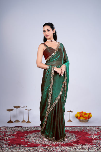 Kanyaari Kriti stylish green saree with intricate cutdana work, showcasing elegant traditional embroidery and draped fabric.