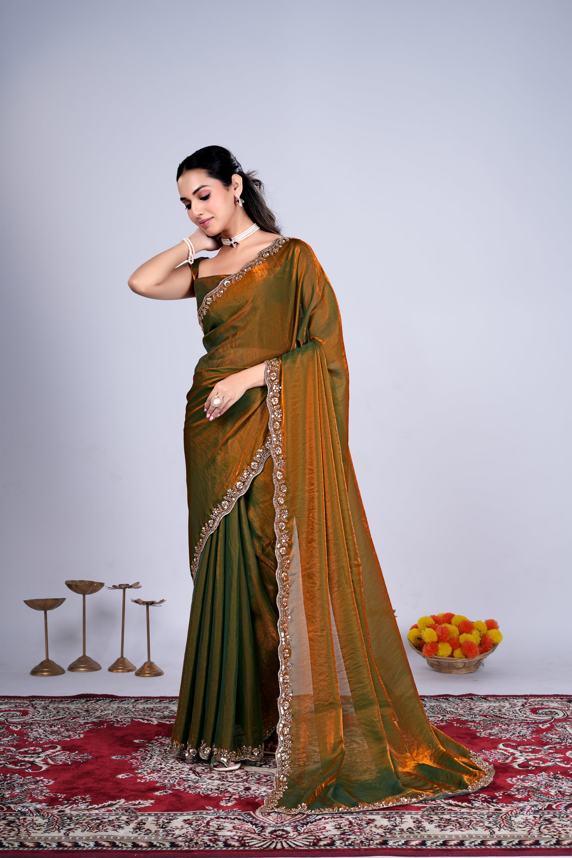 Kanyaari Kriti stylish saree in mehndi color with intricate cutdana work, draped elegantly showcasing detailed embroidery and fabric.