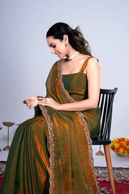 Kriti Stylish Mehndi color saree with intricate cutdana work by Kanyaari, featuring traditional Indian embroidery and elegant drape.
