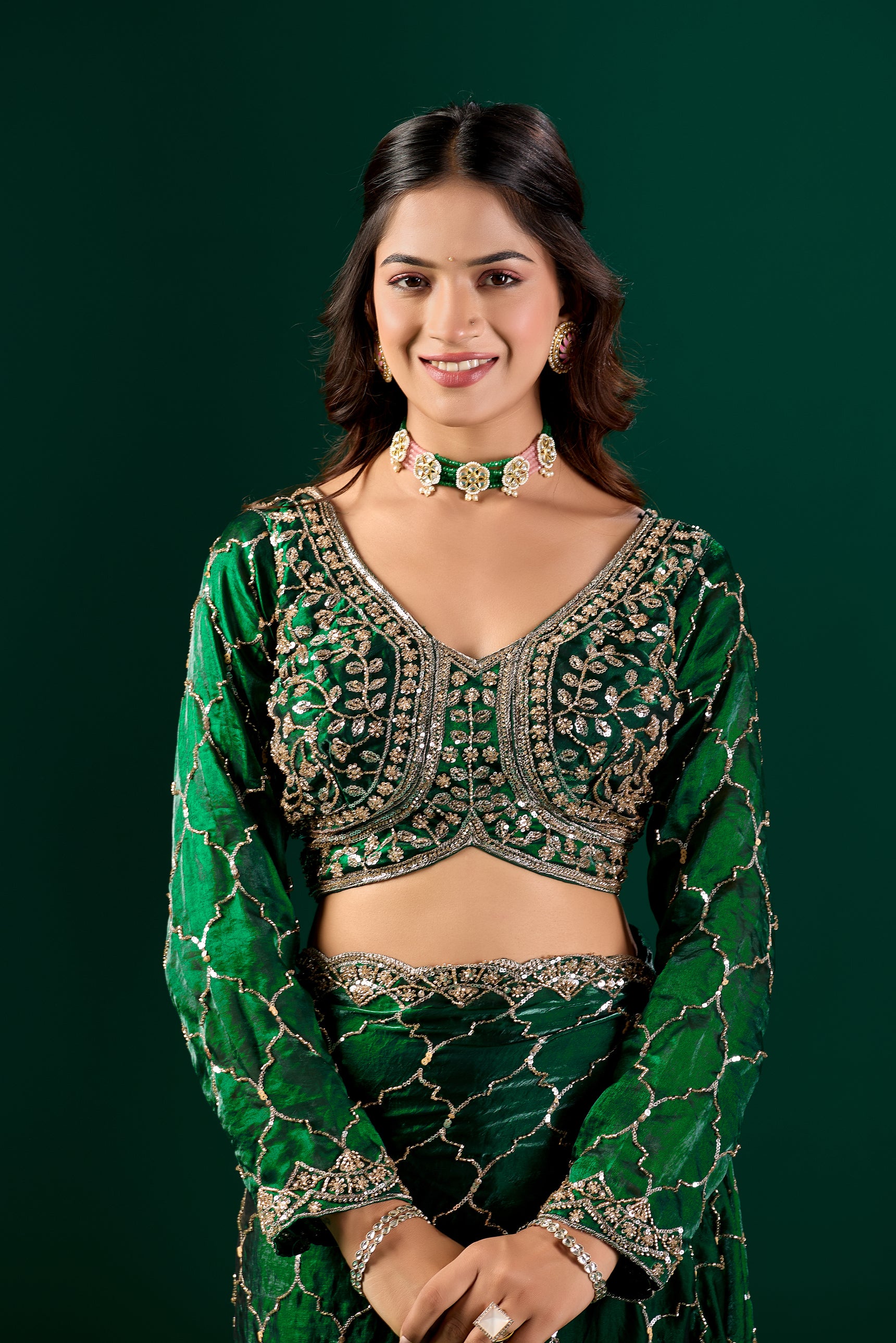 Green silk saree with rose gold cutdana work, luxurious Barsana design by Kanyaari, detailed fabric and intricate embroidery visible.