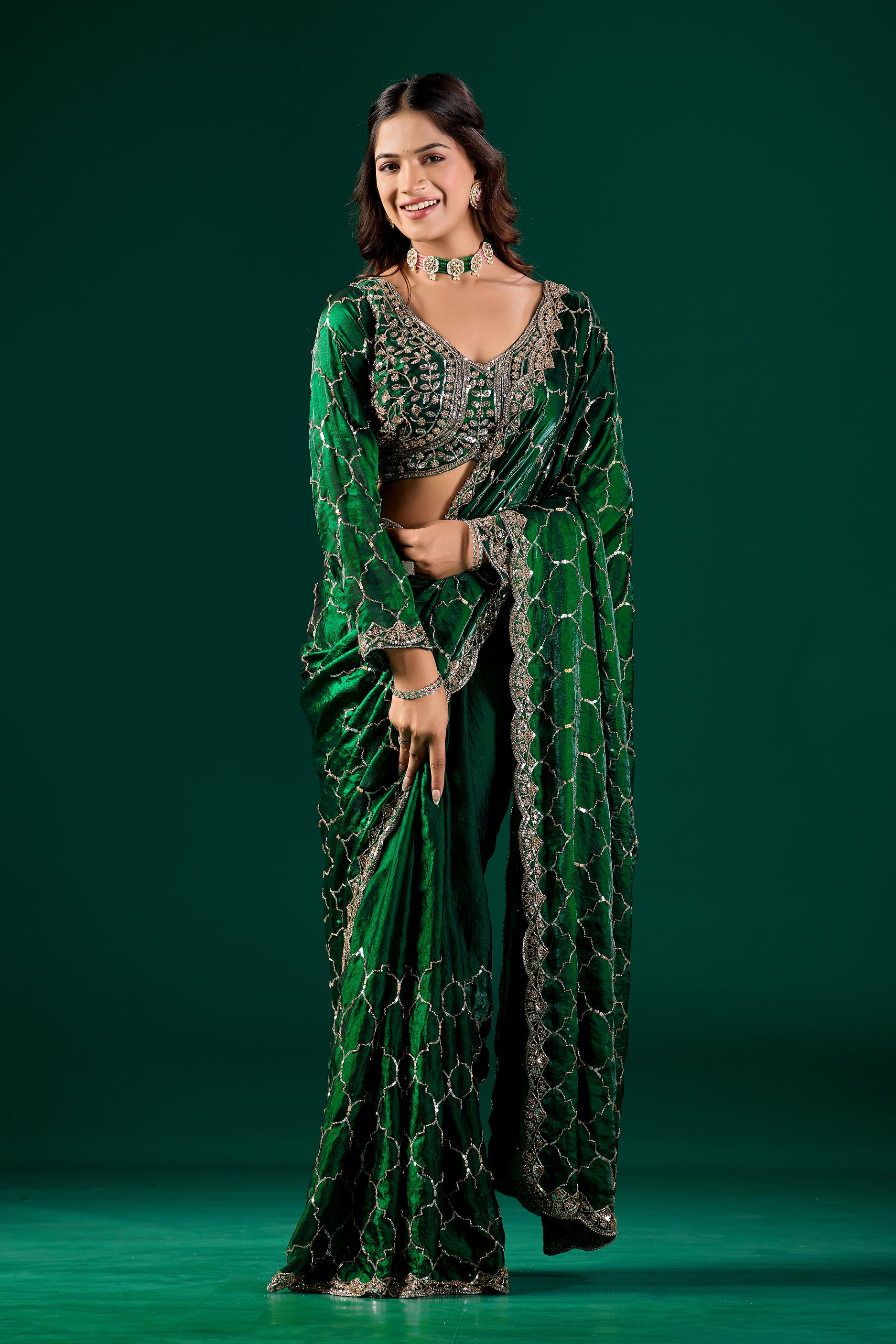 Green silk saree with rose gold cutdana work, luxurious Barsana design by Kanyaari, featuring intricate embroidery and elegant drape.