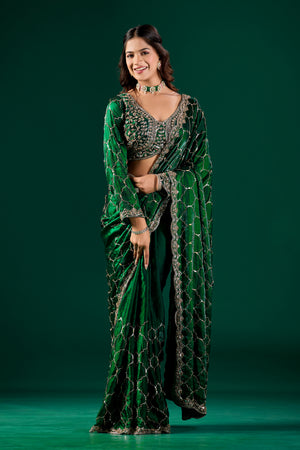 Green silk saree with rose gold cutdana work, luxurious Barsana design by Kanyaari, featuring intricate embroidery and elegant drape.