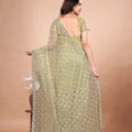 Cross Stylish Green Net saree with Cutdana Work