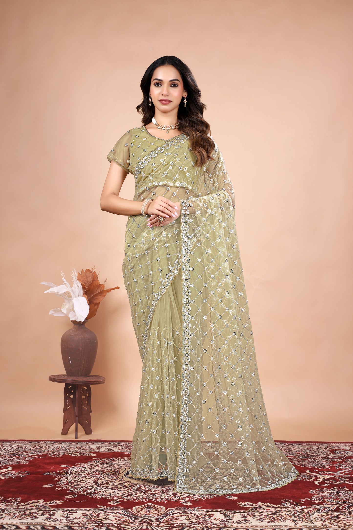 Cross Stylish Green Net saree with Cutdana Work