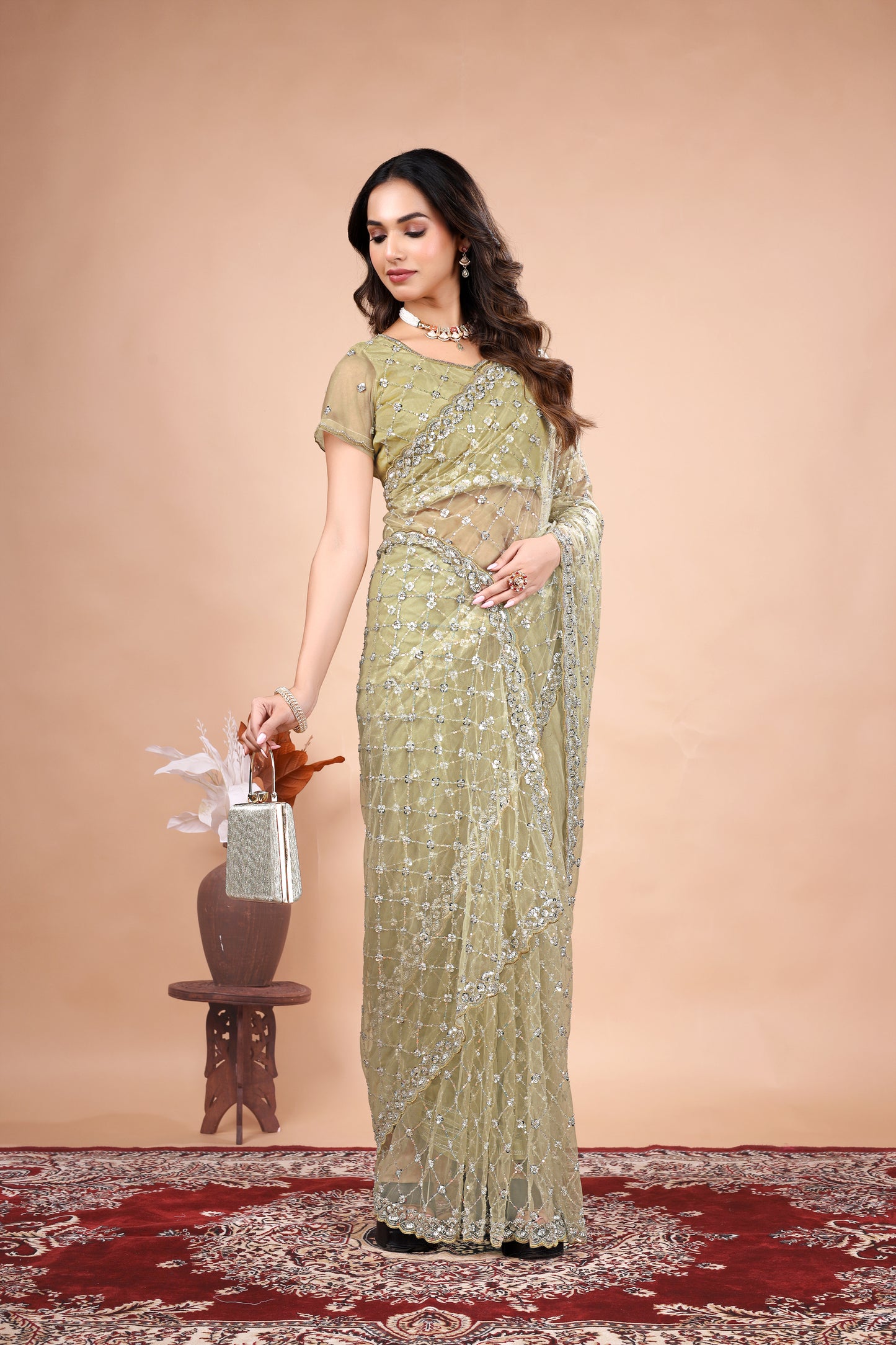 Cross Stylish Green Net saree with Cutdana Work