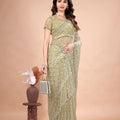 Cross Stylish Green Net saree with Cutdana Work