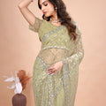 Cross Stylish Green Net saree with Cutdana Work