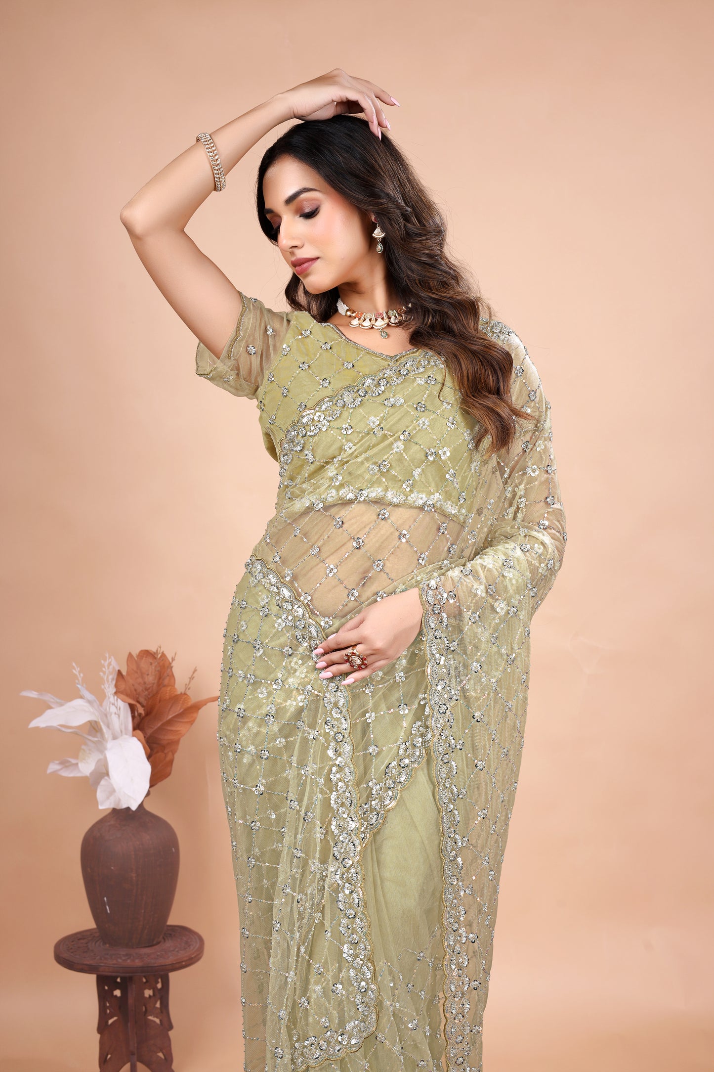 Cross Stylish Green Net saree with Cutdana Work