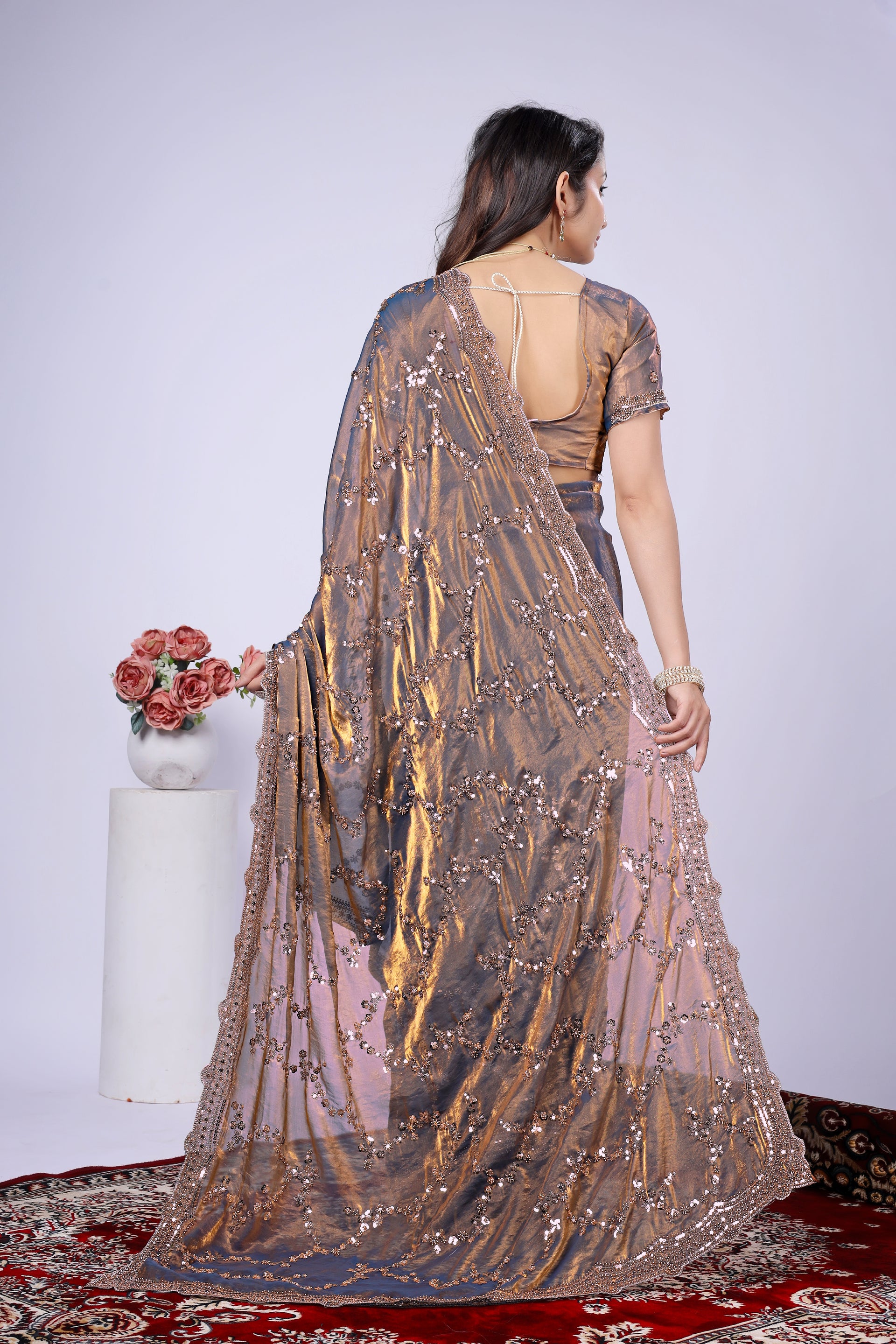 Nakhrali Kanyaari silk saree with rose gold cutdana work, showcasing intricate embroidery and elegant draping.