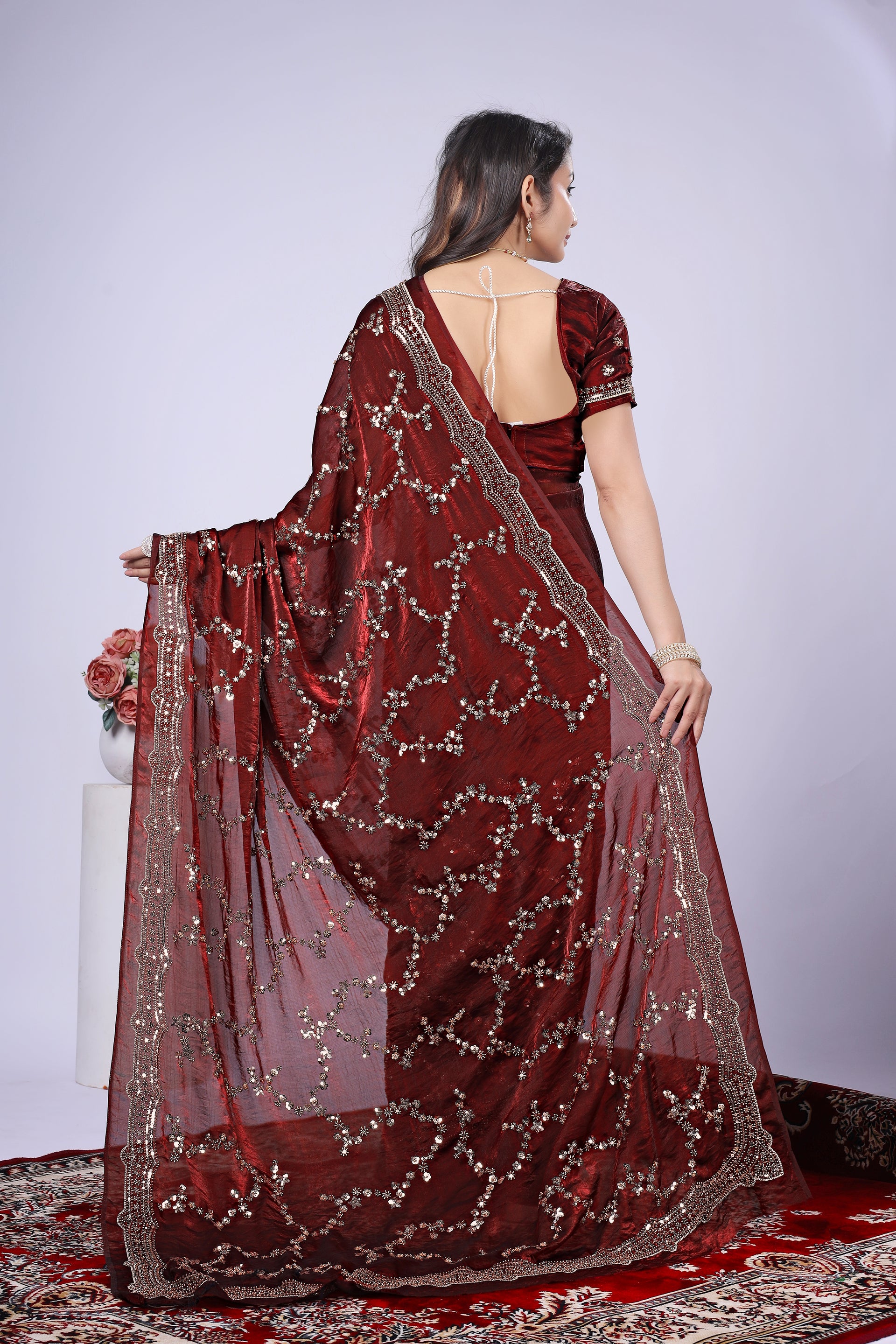 Kanyaari premium maroon silk saree with intricate rose gold cutdana embroidery, elegant traditional Indian attire.