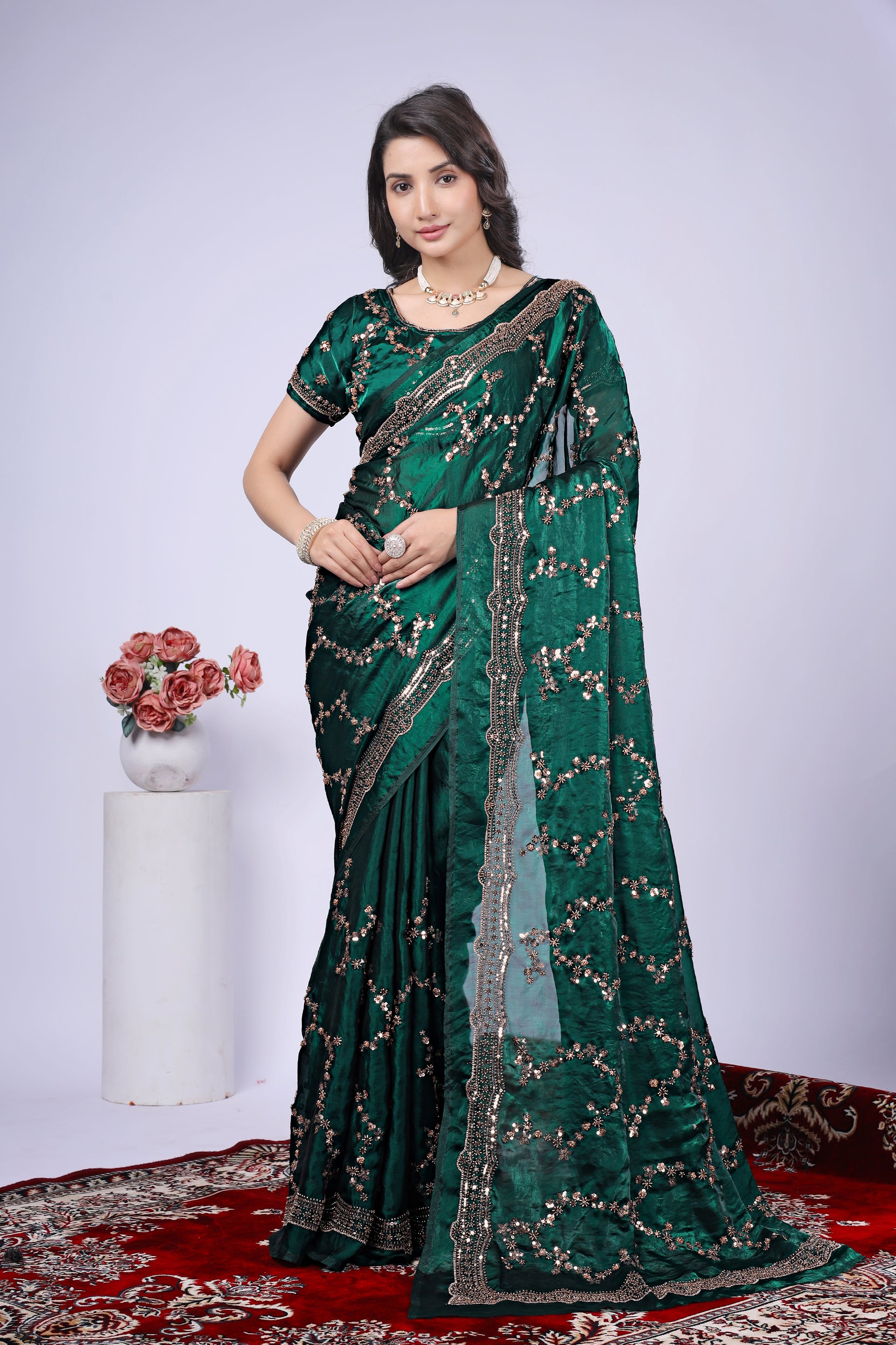 Dark green silk saree by Kanyaari featuring intricate rose gold cutdana work, elegant traditional Indian attire.