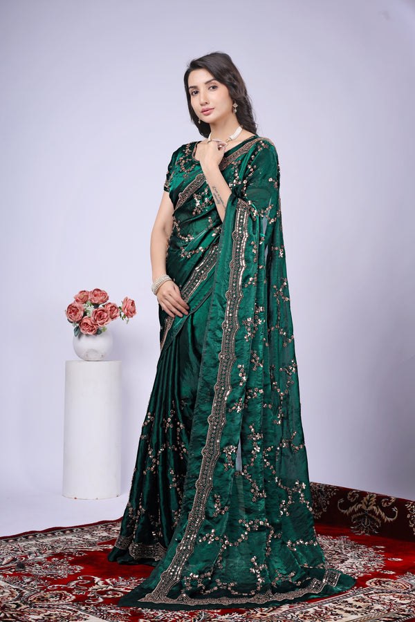 Dark green silk saree by Kanyaari with rose gold cutdana embroidery, showcasing elegant traditional design and intricate craftsmanship.
