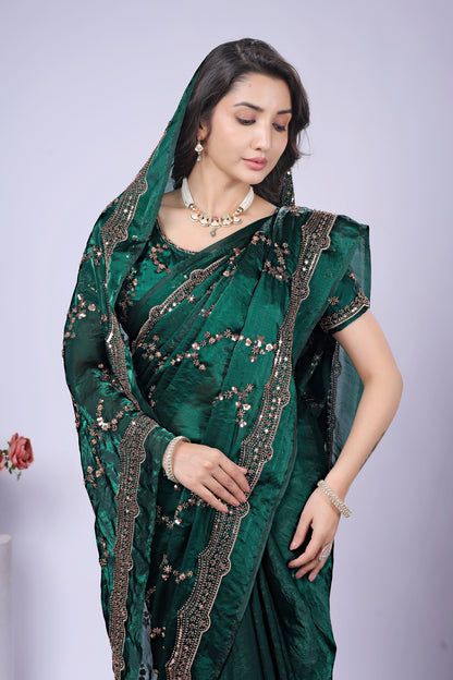 Dark green silk saree by Kanyaari featuring rose gold cutdana work, showcasing elegant craftsmanship and intricate embroidery.