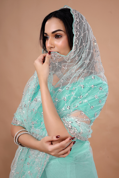 Blue Kanyaari party wear saree with intricate cutdana work and elegant drape, perfect for festive occasions.