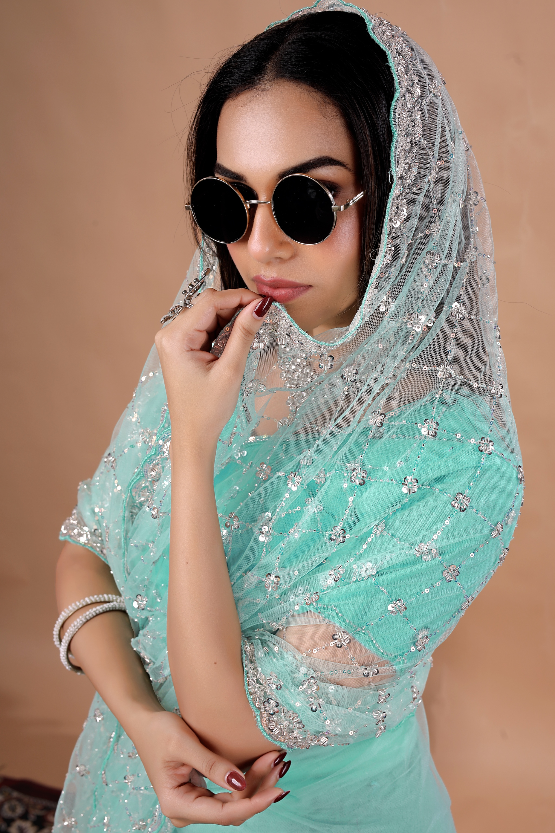 Kanyaari Cross Stylish party wear saree with intricate cutdana work, showcasing elegant draping and detailed embroidery.