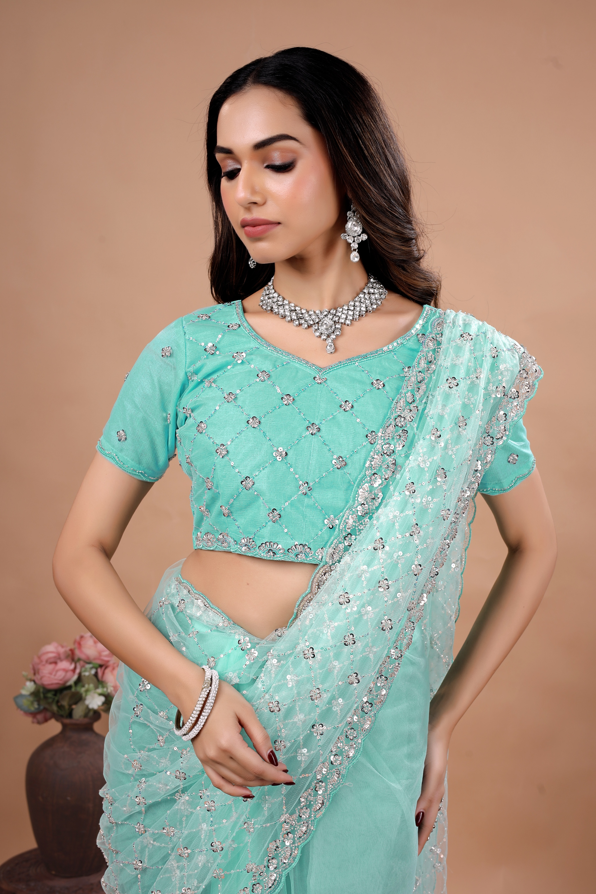 Blue party wear saree with intricate cutdana work by Kanyaari, featuring elegant draping and detailed embroidery.