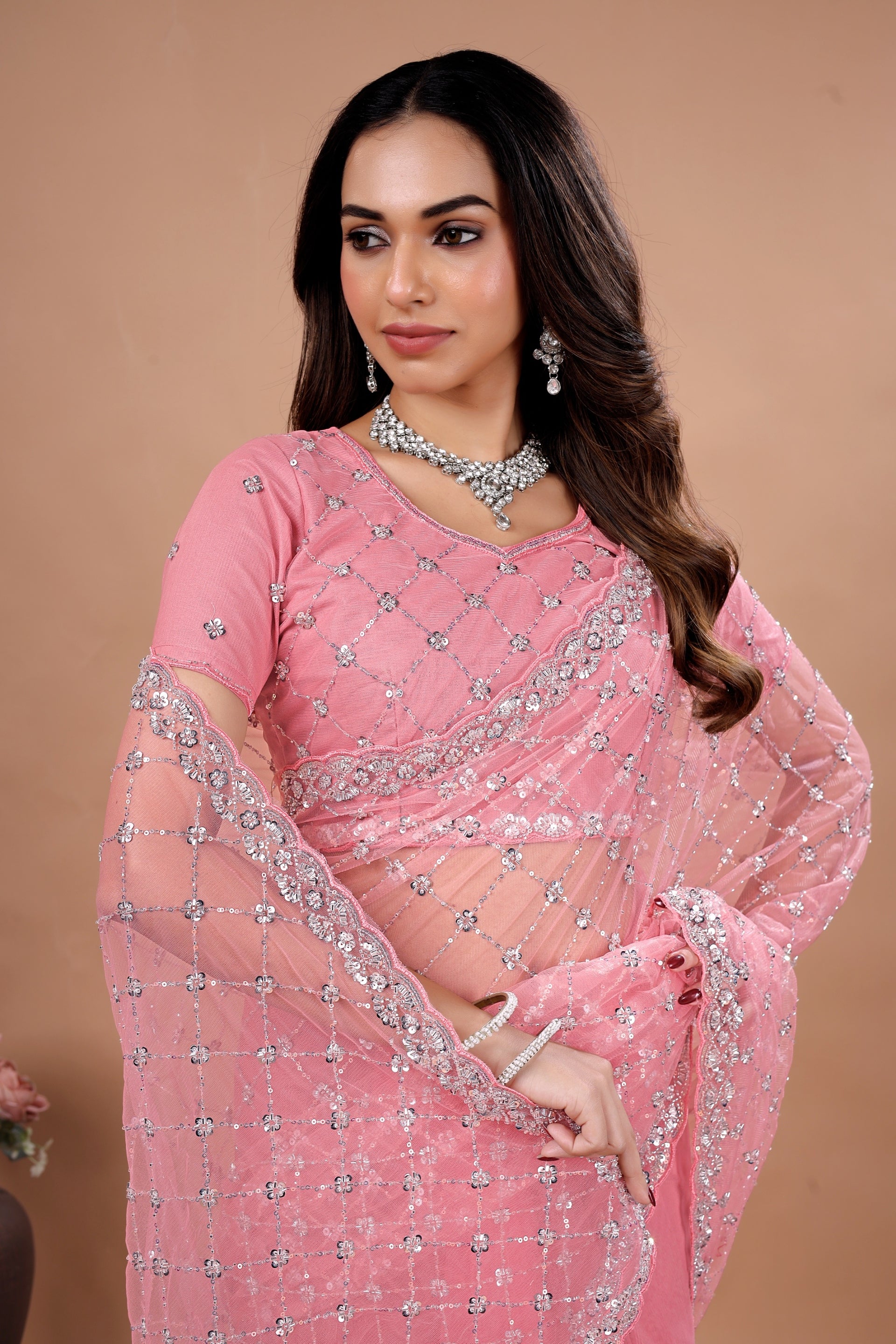 Kanyaari Cross Stylish Party Wear saree with intricate Cutdana work, featuring vibrant fabric and elegant drape for festive occasions.