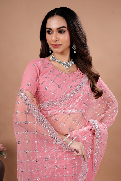 Kanyaari Cross Stylish Party Wear saree with intricate Cutdana work, featuring vibrant fabric and elegant drape for festive occasions.