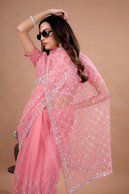 Kanyaari cross stylish party wear saree with intricate cutdana work, draped elegantly showcasing detailed embroidery and fabric texture.