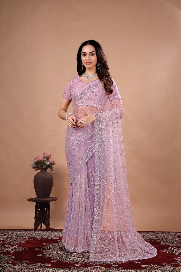 Lavender party wear saree with cutdana work by Kanyaari, featuring elegant drape and intricate detailing for special occasions.
