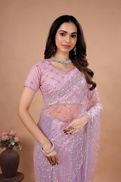 Lavender party wear saree with intricate cutdana work by Kanyaari, featuring elegant draping and detailed embroidery.