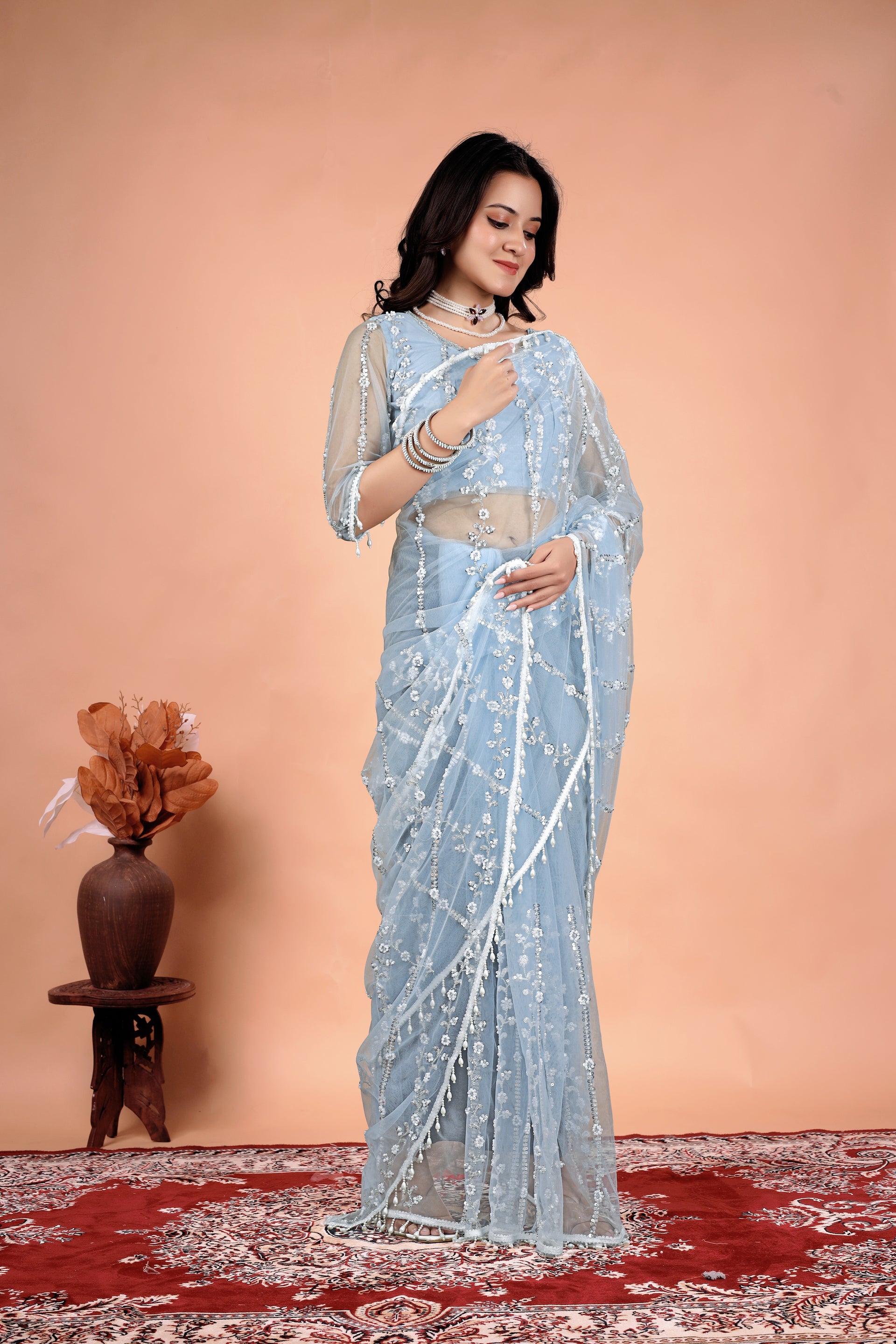 Kanyaari Tamanaa stylish saree with intricate cutdana and sequins work, featuring elegant draping and detailed embellishments.