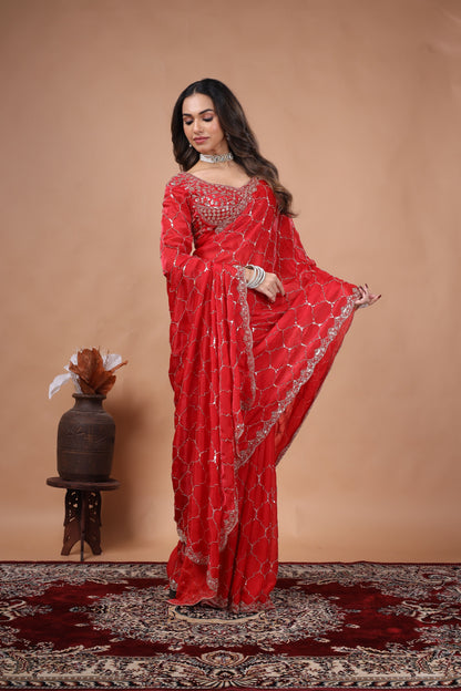 Red silk saree with rose gold cutdana embroidery by Kanyaari, featuring intricate design and elegant drape.