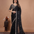 Black heavy saree with cutdana work by Kanyaari, featuring intricate embroidery and traditional design details.