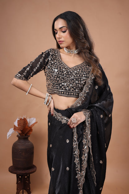 Black heavy saree with cutdana work by Kanyaari, featuring intricate embellishments and traditional design.