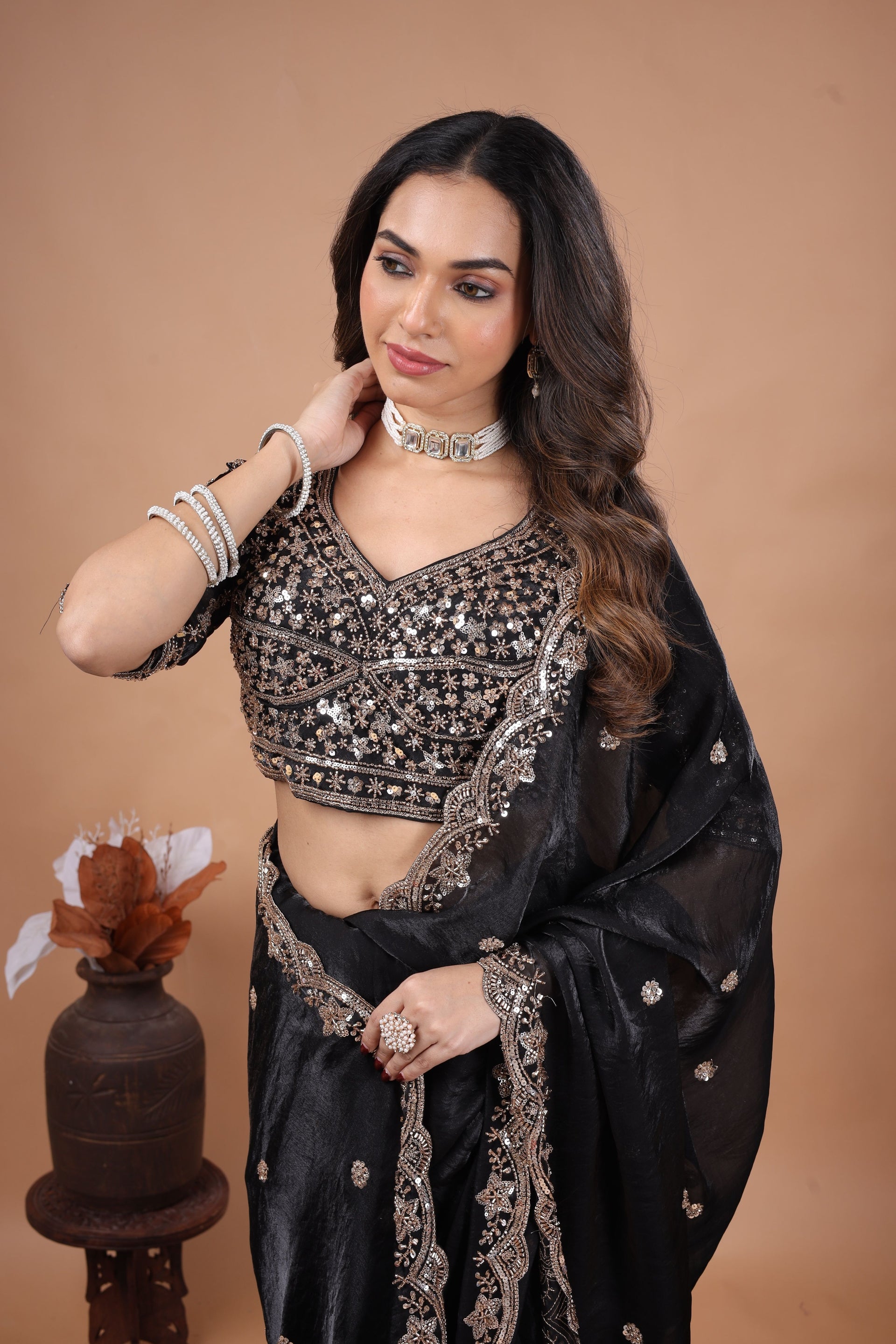 Kanyaari full heavy black saree with intricate cutdana work, showcasing detailed embroidery and traditional Indian design.