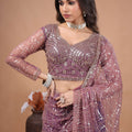 Kanyaari Styalish Net purple saree with heavy cutdana embroidery, featuring intricate embellishments and traditional design.
