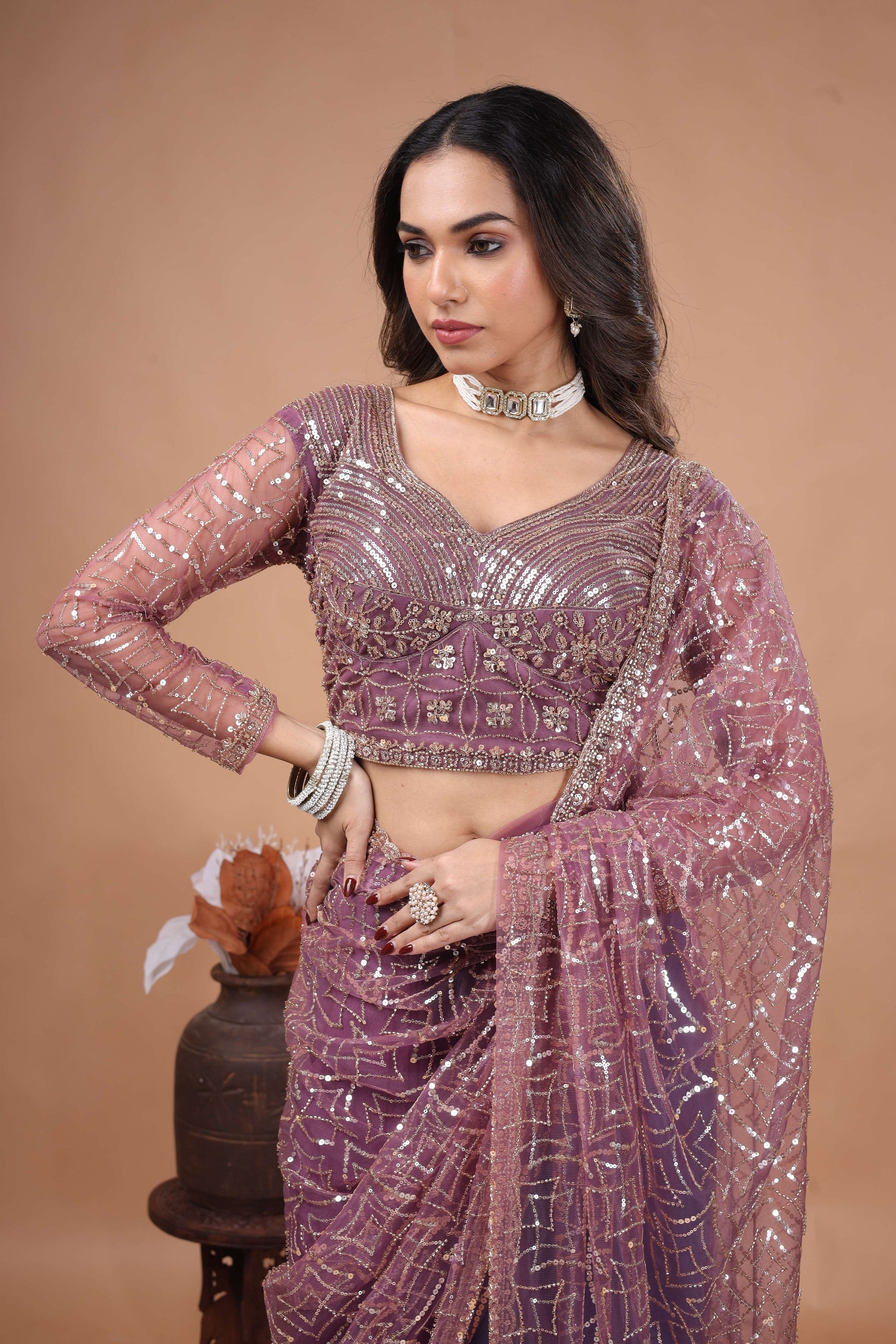 Kanyaari Styalish Net purple saree with heavy cutdana embroidery, featuring intricate embellishments and traditional design.