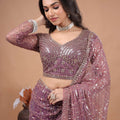 Purple Kanyaari saree with heavy cutdana embroidery and net fabric, featuring intricate design and elegant drape.