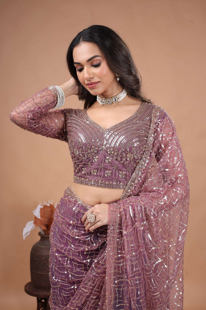 Purple Kanyaari saree with heavy cutdana embroidery and net fabric, featuring intricate design and elegant drape.