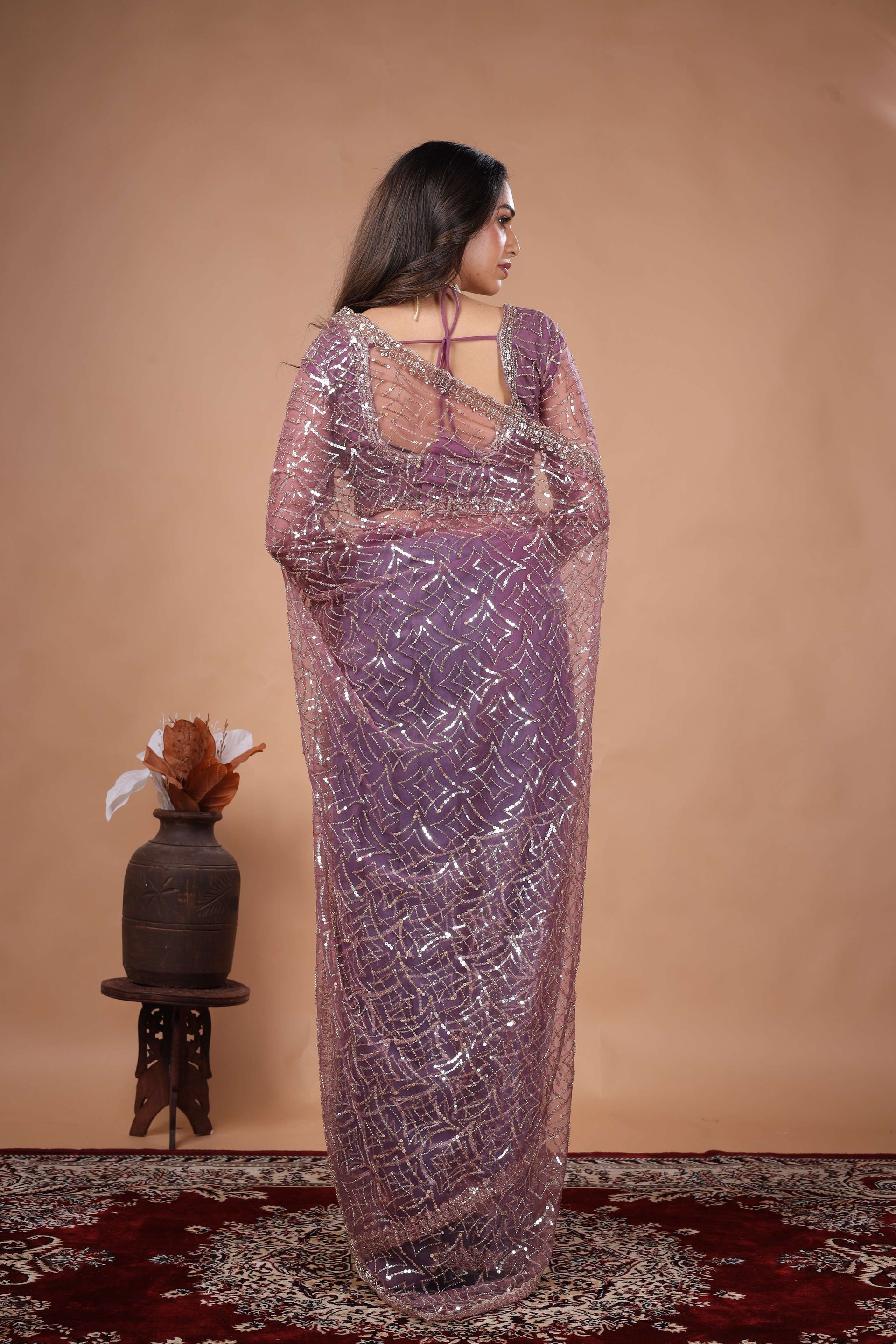 Kanyaari Styalish Net purple saree with heavy cutdana embroidery and intricate design, worn by Katrina for a traditional look.